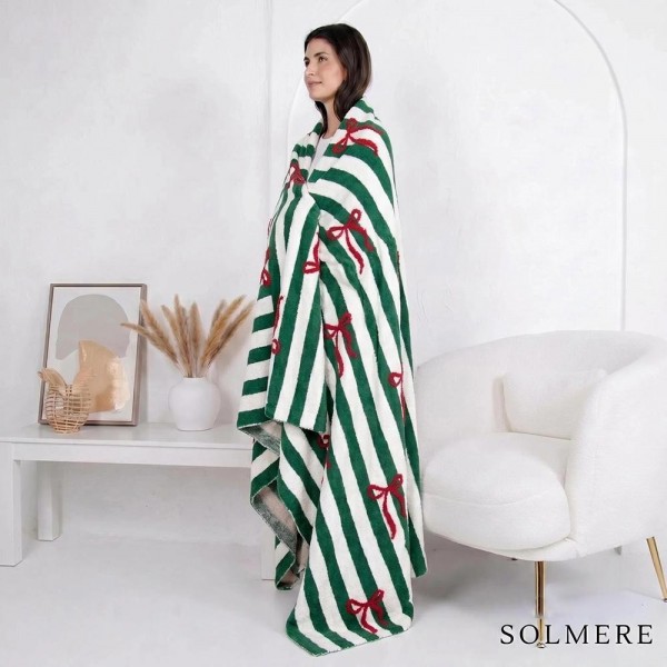 Solmere Blanket – Stripe Bow Christmas Blanket

Wrap yourself in pure indulgence. Our Solmere Blanket combines a fashion-forward design with an irresistibly soft hand-feel that’s as beautiful as it is cozy.

- Luxuriously Soft – Crafted from ultra-plush, high-quality fibers you’ll want to snuggle into all season long.

- Perfectly Sized – Approximately 50” W x 60” L, perfect for draping over your sofa, bed, or yourself.

- Premium Craftsmanship – 100% polyester for lasting softness, warmth, and easy care.

- Thoughtful Packaging – Each blanket is tied with a branded ribbon in a bow and includes two cards: one featuring the SOLMERE brand and another showcasing a high-quality image of the blanket’s print. Individually packaged

Once you touch it, you’ll understand why SOLMERE blankets are love at first feel.