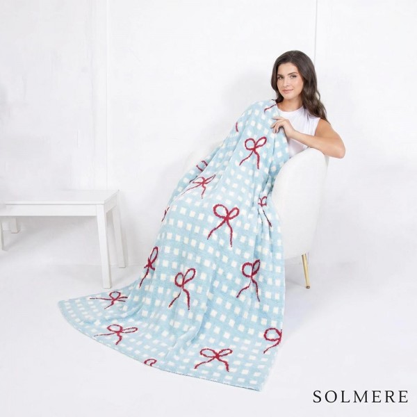 Solmere Blanket – Plaid Bow Blanket 

Wrap yourself in pure indulgence. Our Solmere Blanket combines a fashion-forward design with an irresistibly soft hand-feel that’s as beautiful as it is cozy.

- Luxuriously Soft – Crafted from ultra-plush, high-quality fibers you’ll want to snuggle into all season long.

- Perfectly Sized – Approximately 50” W x 60” L, perfect for draping over your sofa, bed, or yourself.

- Premium Craftsmanship – 100% polyester for lasting softness, warmth, and easy care.

- Thoughtful Packaging – Each blanket is tied with a branded ribbon in a bow and includes two cards: one featuring the SOLMERE brand and another showcasing a high-quality image of the blanket’s print. Individually packaged

Once you touch it, you’ll understand why SOLMERE blankets are love at first feel.