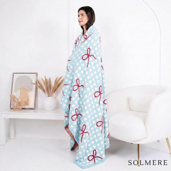 Solmere Blanket – Plaid Bow Blanket 

Wrap yourself in pure indulgence. Our Solmere Blanket combines a fashion-forward design with an irresistibly soft hand-feel that’s as beautiful as it is cozy.

- Luxuriously Soft – Crafted from ultra-plush, high-quality fibers you’ll want to snuggle into all season long.

- Perfectly Sized – Approximately 50” W x 60” L, perfect for draping over your sofa, bed, or yourself.

- Premium Craftsmanship – 100% polyester for lasting softness, warmth, and easy care.

- Thoughtful Packaging – Each blanket is tied with a branded ribbon in a bow and includes two cards: one featuring the SOLMERE brand and another showcasing a high-quality image of the blanket’s print. Individually packaged

Once you touch it, you’ll understand why SOLMERE blankets are love at first feel.
