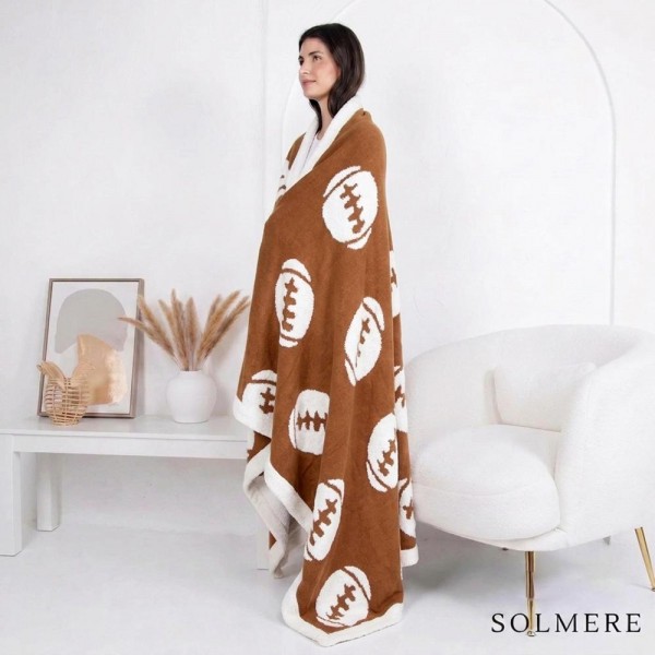 Solmere Blanket – 3D Football Blanket

Wrap yourself in pure indulgence. Our Solmere Blanket combines a fashion-forward design with an irresistibly soft hand-feel that’s as beautiful as it is cozy.

- Luxuriously Soft – Crafted from ultra-plush, high-quality fibers you’ll want to snuggle into all season long.

- Perfectly Sized – Approximately 50” W x 60” L, perfect for draping over your sofa, bed, or yourself.

- Premium Craftsmanship – 100% polyester for lasting softness, warmth, and easy care.

- Thoughtful Packaging – Each blanket is tied with a branded ribbon in a bow and includes two cards: one featuring the SOLMERE brand and another showcasing a high-quality image of the blanket’s print. Individually packaged

Once you touch it, you’ll understand why SOLMERE blankets are love at first feel.