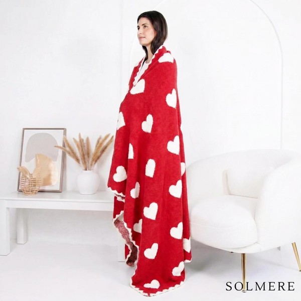 Solmere Blanket – White Scallop Bordered Heart Blanket

Wrap yourself in pure indulgence. Our Solmere Blanket combines a fashion-forward design with an irresistibly soft hand-feel that’s as beautiful as it is cozy.

- Luxuriously Soft – Crafted from ultra-plush, high-quality fibers you’ll want to snuggle into all season long.

- Perfectly Sized – Approximately 50” W x 60” L, perfect for draping over your sofa, bed, or yourself.

- Premium Craftsmanship – 100% polyester for lasting softness, warmth, and easy care.

- Thoughtful Packaging – Each blanket is tied with a branded ribbon in a bow and includes two cards: one featuring the SOLMERE brand and another showcasing a high-quality image of the blanket’s print. Individually packaged

Once you touch it, you’ll understand why SOLMERE blankets are love at first feel.

View more SOLMERE Blankets, Fall / Winter 2025, Blankets and Pillows