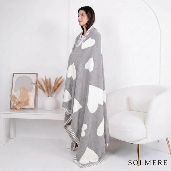 Solmere Blanket – Gray Heart Blanket

Wrap yourself in pure indulgence. Our Solmere Blanket combines a fashion-forward design with an irresistibly soft hand-feel that’s as beautiful as it is cozy.

- Luxuriously Soft – Crafted from ultra-plush, high-quality fibers you’ll want to snuggle into all season long.

- Perfectly Sized – Approximately 50” W x 60” L, perfect for draping over your sofa, bed, or yourself.

- Premium Craftsmanship – 100% polyester for lasting softness, warmth, and easy care.

- Thoughtful Packaging – Each blanket is tied with a branded ribbon in a bow and includes two cards: one featuring the SOLMERE brand and another showcasing a high-quality image of the blanket’s print. Individually packaged

Once you touch it, you’ll understand why SOLMERE blankets are love at first feel.

View more SOLMERE Blankets, Fall / Winter 2025, Blankets and Pillows