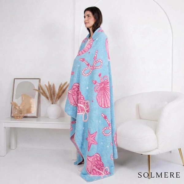 Solmere Blanket – Nautical Blanket

Wrap yourself in pure indulgence. Our Solmere Blanket combines a fashion-forward design with an irresistibly soft hand-feel that’s as beautiful as it is cozy.

- Luxuriously Soft – Crafted from ultra-plush, high-quality fibers you’ll want to snuggle into all season long.

- Perfectly Sized – Approximately 50” W x 60” L, perfect for draping over your sofa, bed, or yourself.

- Premium Craftsmanship – 100% polyester for lasting softness, warmth, and easy care.

- Thoughtful Packaging – Each blanket is tied with a branded ribbon in a bow and includes two cards: one featuring the SOLMERE brand and another showcasing a high-quality image of the blanket’s print. Individually packaged

Once you touch it, you’ll understand why SOLMERE blankets are love at first feel.

View more SOLMERE Blankets, Fall / Winter 2025, Blankets and Pillows