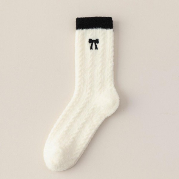 Add a coquette-coded staple to your sock wall with this assorted six-pack of pointelle knit crew socks finished with a dainty embroidered bow at the cuff. The delicate openwork knit gives each pair a feminine, vintage-leaning texture, while the contrast bow detail adds the kind of small, photo-ready touch that drives social shares and quick reorders. The mid-calf length pairs effortlessly with mary janes, ballet flats, loafers, and white sneakers. A boutique-perfect pick for younger shoppers chasing the soft-girl aesthetic, gift sets, bridesmaid party favors, and Valentine displays where charm matters as much as comfort.
