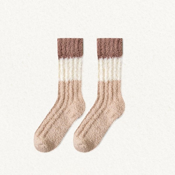 Bring soft-textured, fashion-forward hosiery to your wall with this assorted six-pack of ribbed knit plush crew socks. Each pair is spun from a brushed, fuzzy yarn blend with a vertical rib pattern that adds visual interest and a slimming look on the leg. A contrasting color-block cuff finishes the design and gives every pair a quietly elevated, on-trend feel. The mid-calf length and stretch ribbed top layer easily over leggings, joggers, and ankle boots. A boutique-friendly crowd-pleaser for cozy season — perfect for self-care displays, neighbor gifts, and stocking sets that need a little something extra.