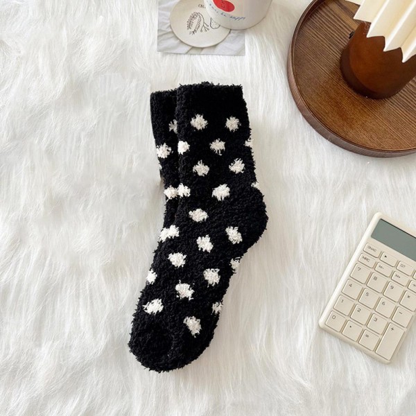 Round out your cozy basics with this assorted six-pack of plush polka dot crew socks designed to feel like a hug for the feet. Knit from a brushed, fuzzy yarn blend with a high-softness loft, each pair carries a timeless dot pattern that reads sweet, simple, and easy to merchandise across boutique aesthetics. The mid-calf length and stretch ribbed cuff layer naturally under jeans, leggings, and lounge pants. A no-brainer add-on for gift sets, bridesmaid favors, hostess bundles, and self-care displays — the kind of impulse buy that walks out the door right next to a candle or coffee mug.