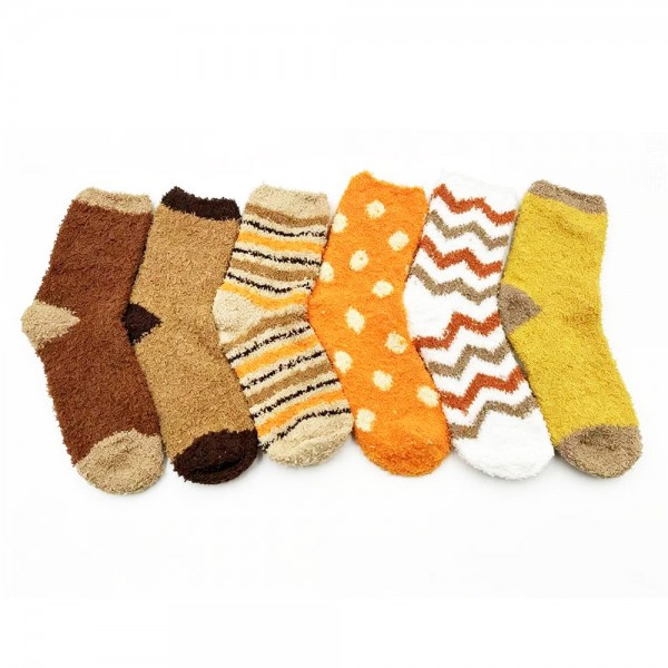 Add ultra-soft texture and easy gifting power to your hosiery wall with this assorted six-pack of plush feather-knit crew socks. Spun from a brushed, fuzzy yarn blend that feels cloud-soft against the skin, each pair in the pack features a different design — think tonal stripes, classic polka dots, and graphic chevron motifs — for instant variety without the buying headache. The mid-calf length and stretch ribbed cuff layer beautifully over leggings, joggers, and lounge pants. A natural fit for cozy displays, bridal party gifting, hostess sets, and impulse-buy bins at the register.