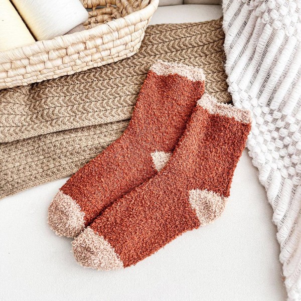 Add ultra-soft texture and easy gifting power to your hosiery wall with this assorted six-pack of plush feather-knit crew socks. Spun from a brushed, fuzzy yarn blend that feels cloud-soft against the skin, each pair in the pack features a different design — think tonal stripes, classic polka dots, and graphic chevron motifs — for instant variety without the buying headache. The mid-calf length and stretch ribbed cuff layer beautifully over leggings, joggers, and lounge pants. A natural fit for cozy displays, bridal party gifting, hostess sets, and impulse-buy bins at the register.