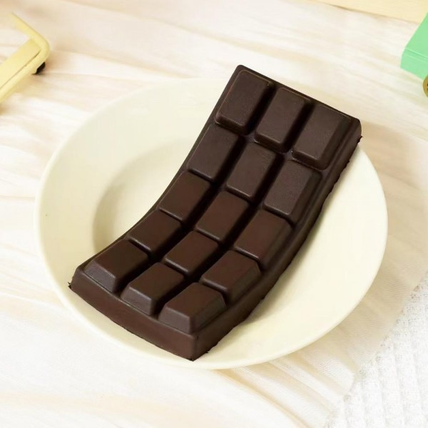 This chocolate bar squishy toy is a sweet novelty gift that sells itself. Shaped like a classic segmented confection bar with realistic molded detail, it is made from slow-rise memory foam for a satisfying squeeze and a tactile stress-relief experience kids and adults both love. A strong performer in gift shops, candy boutiques, and novelty retailers — it ships flat, stores easily, and has broad customer appeal as a fun, affordable impulse pick or small gift under ten dollars.