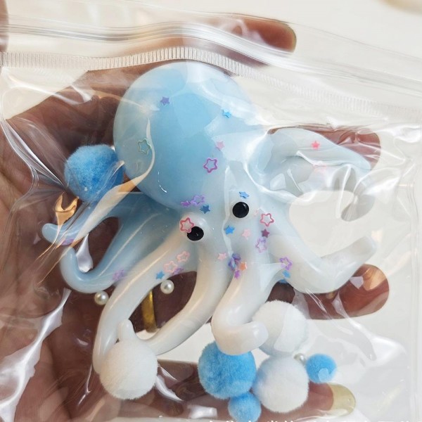 This translucent jelly octopus is a wiggly, tactile novelty toy that customers of all ages love. Made from a soft, stretchy gel material with a squishy, flexible body and dangling tentacles, it delivers a uniquely satisfying sensory experience. The see-through finish gives it a fun, eye-catching look on display. Perfect for novelty boutiques, toy retailers, and gift shops — it drives impulse purchases and excites customers on contact. A must-have for any squishy and novelty toy assortment.