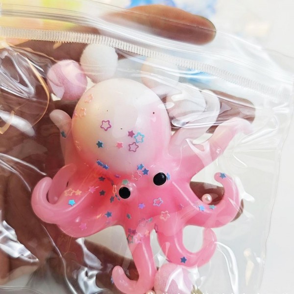 This translucent jelly octopus is a wiggly, tactile novelty toy that customers of all ages love. Made from a soft, stretchy gel material with a squishy, flexible body and dangling tentacles, it delivers a uniquely satisfying sensory experience. The see-through finish gives it a fun, eye-catching look on display. Perfect for novelty boutiques, toy retailers, and gift shops — it drives impulse purchases and excites customers on contact. A must-have for any squishy and novelty toy assortment.