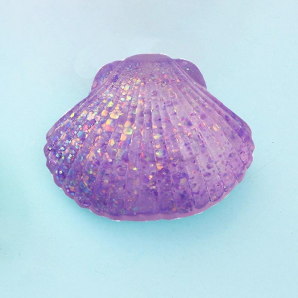 This scallop seashell squishy toy brings seaside charm to any novelty or gift display. Molded with realistic ridged shell detail, it is crafted from soft slow-rise foam that delivers a smooth, satisfying squeeze. Lightweight and compact, it makes a natural impulse buy for coastal boutiques, gift shops, and summer novelty assortments. The detailed shell shape gives it strong shelf presence and broad appeal as a gift, desk toy, or tactile stress reliever. Easy to merchandise in any display setting.