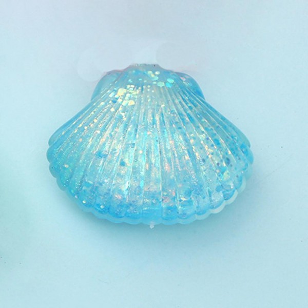 This scallop seashell squishy toy brings seaside charm to any novelty or gift display. Molded with realistic ridged shell detail, it is crafted from soft slow-rise foam that delivers a smooth, satisfying squeeze. Lightweight and compact, it makes a natural impulse buy for coastal boutiques, gift shops, and summer novelty assortments. The detailed shell shape gives it strong shelf presence and broad appeal as a gift, desk toy, or tactile stress reliever. Easy to merchandise in any display setting.