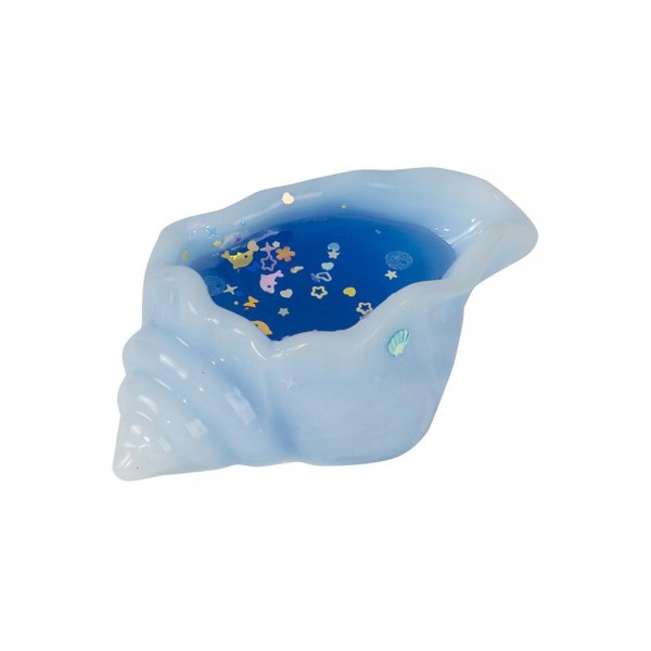 This conch shell squishy toy is a sparkling ocean novelty with standout shelf appeal. Shaped like a classic spiral shell with glitter and bead details that shimmer inside, it delivers both visual appeal and tactile fun. Made from soft, squeezable material with flexible construction, it is irresistible to touch and pick up. A natural fit for coastal boutiques, gift shops, and novelty toy sections — it displays beautifully and appeals to beach lovers, collectors, and impulse shoppers of all ages.