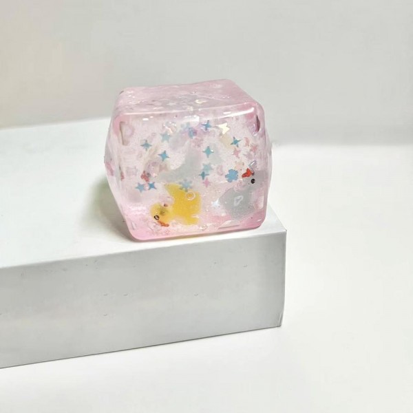This translucent floral cube squishy toy is a decorative novelty with irresistible shelf appeal. Its soft, clear squeeze body reveals a floating floral confetti design inside, making it as pretty as it is fun to squish. Made from soft, flexible material with a satisfying tactile feel, it appeals to gift buyers, decor enthusiasts, and novelty toy shoppers alike. A standout impulse buy for gift boutiques and novelty retailers — it photographs beautifully and generates strong customer interest.