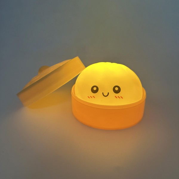 Light Up Dumpling Squishy Toy

Cute novelty squishy toy designed as a smiling dumpling in a bamboo-style steamer. Perfect for gifts, impulse buys, and food-themed novelty displays.

- LED 
- Ages 3+
- Approximately 3" L