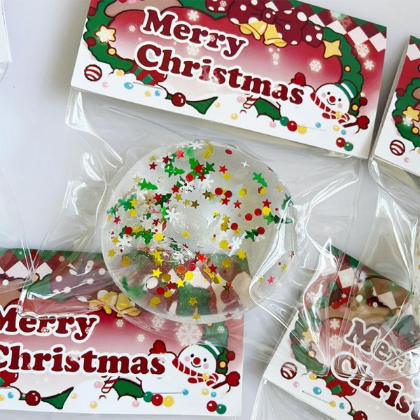 Christmas Glitter Donut Squishy Toy

Cute novelty squishy toy designed as a glitter donut. Perfect for gifts, impulse buys, and food-themed novelty displays.

- Ages 3+
- Approximately 3" L