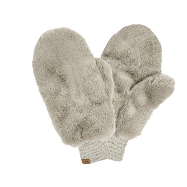 Plush faux fur mittens with a dense soft pile outside and a knit cuff that seals warmth in at the wrist. The lined interior keeps hands warm on a walk to the car or a morning at a market without the bulk of a ski glove. Light enough to stuff in a coat pocket and soft enough that customers keep touching them on the display. Faux fur mittens are a strong gift item and an easy pairing with beanies and scarves.