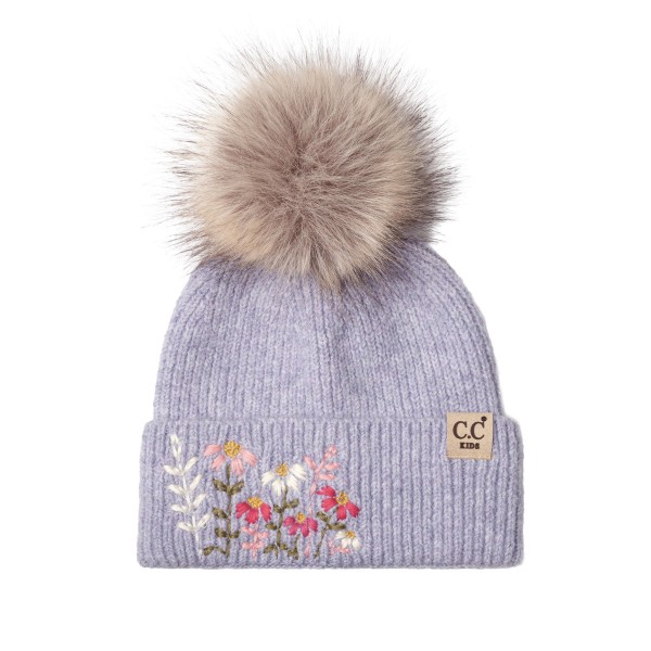 Kids knit pom beanie with delicate embroidered flowers on a fold over cuff and a fluffy faux fur pom on top. The soft ribbed knit stretches for a comfortable fit and keeps little ears warm on cold school mornings and weekend outings. A sweet, feminine design that parents love for holiday photos and gifting. Floral kids beanies sell fast as stocking stuffers and pair perfectly with matching mittens.