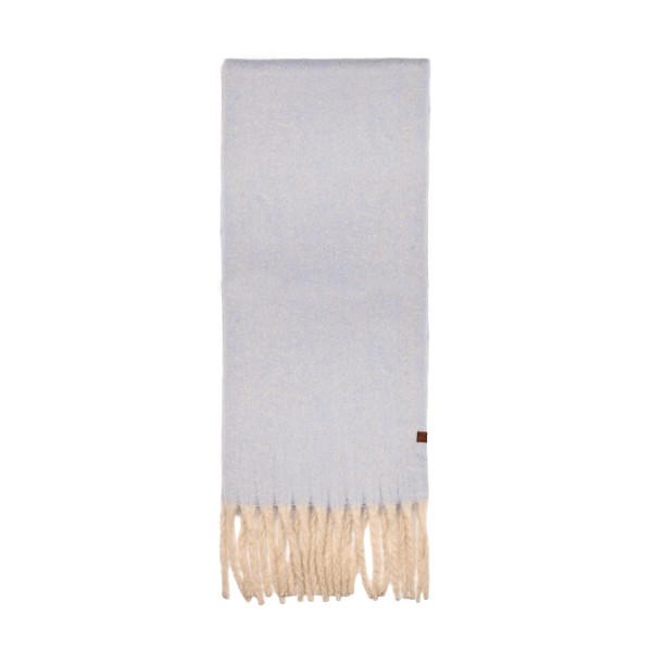 Brushed heavyweight scarf with a soft napped face and fringed ends, cut long enough to wrap twice and still hang past the chest. The dense weave holds warmth on a cold morning without the itch of a coarse wool. A solid finish layers over every coat and every print already on the floor, which makes it an easy pairing sale. Fringed winter scarves are a proven cold weather driver and they gift well with no extra packaging.