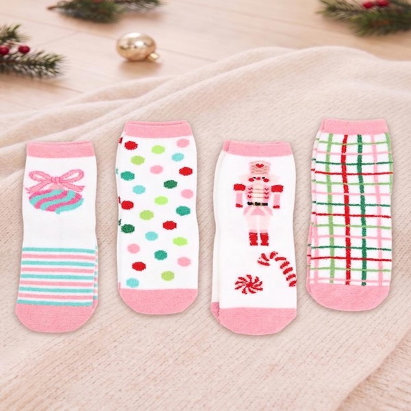 Holiday crew sock set with four coordinating pairs in a soft cotton blend knit with cushioned soles. Ribbed cuffs stay put without digging in, and the seasonal motifs are knit in rather than printed so they survive the wash. A ready made gift for boutique buyers stocking stocking stuffers, teacher gifts, secret santa, and holiday markets. Boxed sock sets ring up as an easy impulse grab and reorder through December.