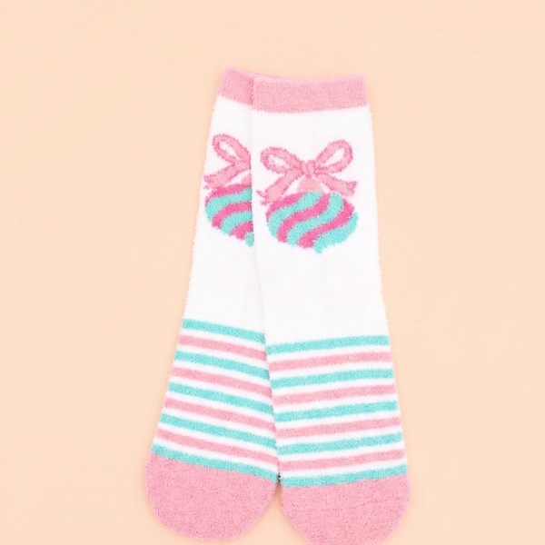 Holiday crew sock set with four coordinating pairs in a soft cotton blend knit with cushioned soles. Ribbed cuffs stay put without digging in, and the seasonal motifs are knit in rather than printed so they survive the wash. A ready made gift for boutique buyers stocking stocking stuffers, teacher gifts, secret santa, and holiday markets. Boxed sock sets ring up as an easy impulse grab and reorder through December.