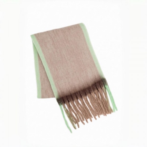 Oversized Plaid Blanket Scarf with soft brushed finish and fringed edges. Generously sized to wear looped, draped, or wrapped as a shawl, it layers beautifully over coats and sweaters for instant cold-weather polish. A fall and winter staple that anchors seasonal displays — boutique customers stock multiple patterns because these fly off the shelf as gifts and self-purchases alike.