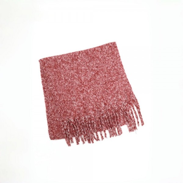 Chunky boucle knit scarf in a lofty marled yarn with long shaggy fringe. Extra wide and extra long, it wraps twice with room to spare and holds warmth without feeling heavy. A cold weather staple for boutique buyers stocking travel, tailgates, farmers markets, and holiday gifting. Oversized knit scarves fill a display fast and reorder in every shade once temperatures drop.