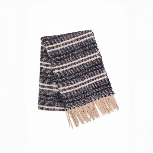 Striped woven scarf in a brushed heavyweight knit with knotted fringe on both ends. Long wrap length loops twice or hangs open over a coat, and the multi stripe weave pairs back to neutrals all season. A cold weather staple for boutique buyers stocking travel, tailgates, farmers markets, and holiday gifting. Striped fringe scarves are the easiest add on at the register and reorder as soon as it turns cold.