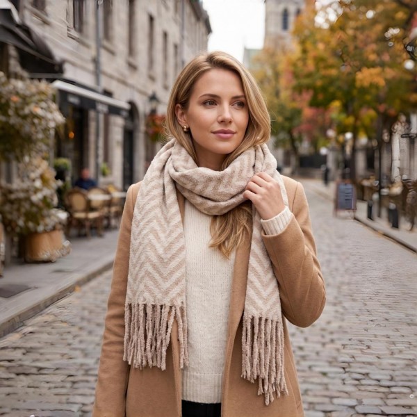 Woven chevron scarf in a brushed heavyweight knit with hand knotted fringe on both ends. Long wrap length loops twice or hangs open over a coat, and the soft two tone weave reads dressy or casual. A cold weather staple for boutique buyers stocking travel, tailgates, farmers markets, and holiday gifting. Fringe scarves are the easiest add on at the register and reorder once temperatures drop.