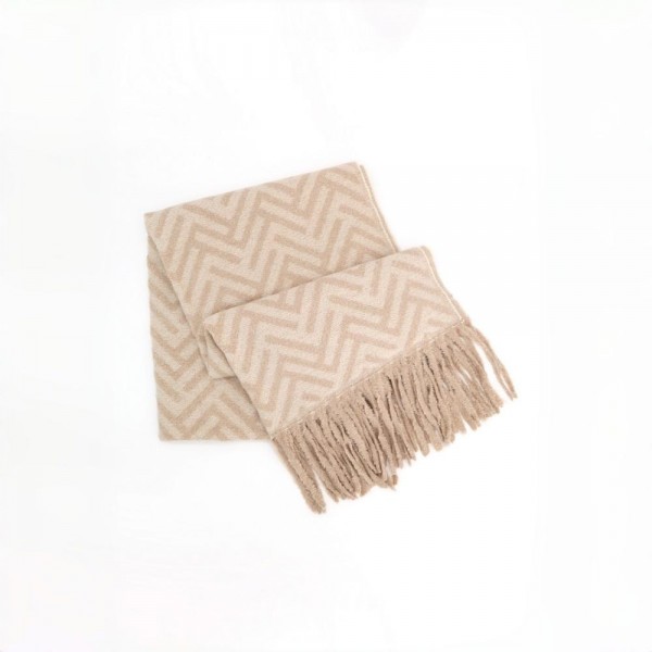 Woven chevron scarf in a brushed heavyweight knit with hand knotted fringe on both ends. Long wrap length loops twice or hangs open over a coat, and the soft two tone weave reads dressy or casual. A cold weather staple for boutique buyers stocking travel, tailgates, farmers markets, and holiday gifting. Fringe scarves are the easiest add on at the register and reorder once temperatures drop.