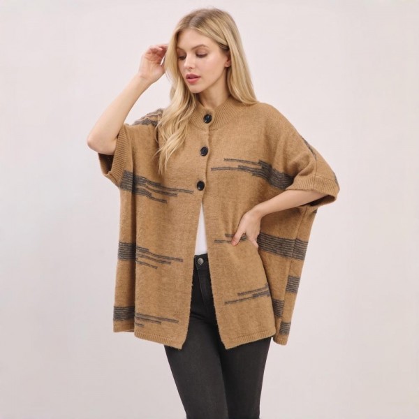 Button front poncho in a brushed blanket knit with a wide contrast stripe and side pockets. One size drape falls past the hip and layers over long sleeves, denim, or leggings without adding bulk. A fall and winter layer for boutique buyers stocking travel, football weekends, church, and cold office mornings. Blanket stripe ponchos read as the statement layer on a mannequin and sell through fast.