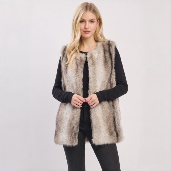 Luxe Faux Fur Longline Vest with plush multi-tonal texture and a sleek hook-and-eye closure. The mid-thigh silhouette adds instant polish layered over sweaters, turtlenecks, and denim — a statement layering piece that elevates any fall or winter outfit. A premium-feel piece that commands attention on the rack and delivers strong margins for boutique sellers.