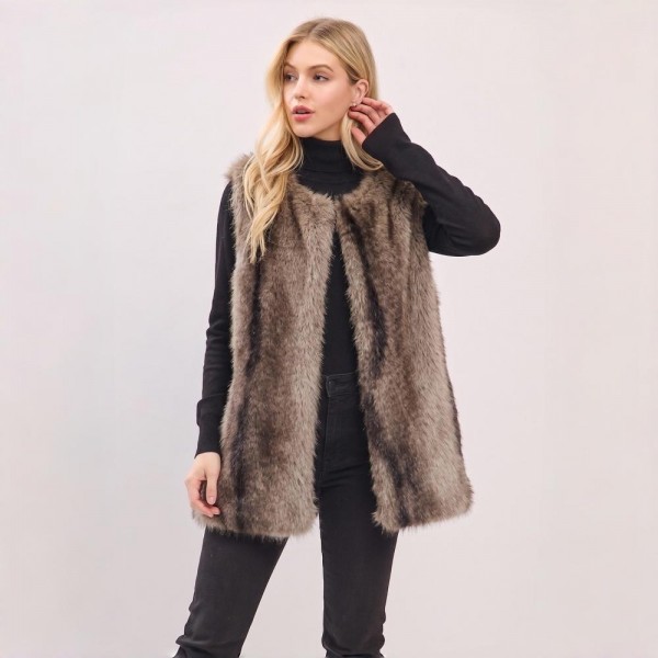 Luxe Faux Fur Longline Vest with plush multi-tonal texture and a sleek hook-and-eye closure. The mid-thigh silhouette adds instant polish layered over sweaters, turtlenecks, and denim — a statement layering piece that elevates any fall or winter outfit. A premium-feel piece that commands attention on the rack and delivers strong margins for boutique sellers.