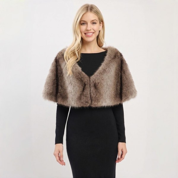 Faux Fur Capelet Shrug with plush layered texture and an elegant cropped silhouette. This shoulder-wrap style tops off dresses, evening looks, and holiday outfits with instant glamour — easy to slip on over any neckline. A dressy occasion piece that shines during holiday and event season; boutique customers snap these up for parties, weddings, and gifting.