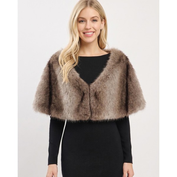 Faux Fur Capelet Shrug with plush layered texture and an elegant cropped silhouette. This shoulder-wrap style tops off dresses, evening looks, and holiday outfits with instant glamour — easy to slip on over any neckline. A dressy occasion piece that shines during holiday and event season; boutique customers snap these up for parties, weddings, and gifting.