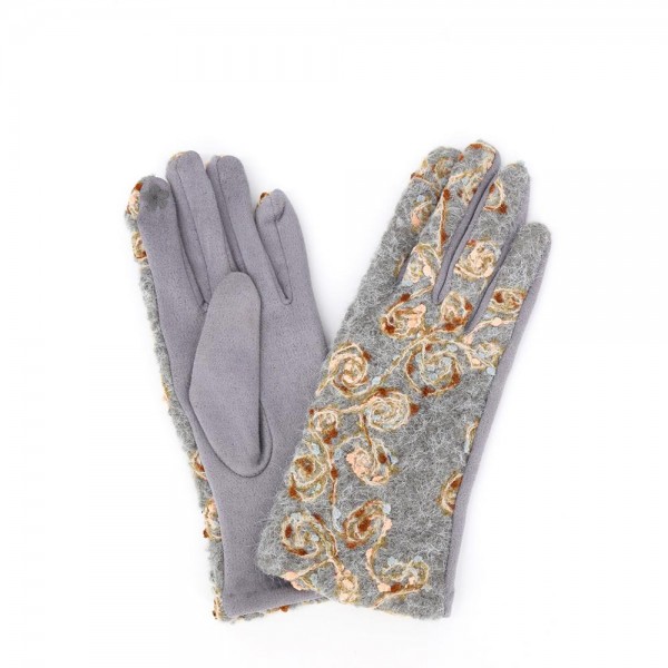 Touchscreen gloves with metallic floral embroidery across a brushed knit back and a soft stretch palm. Conductive fingertips let her text and scroll without taking them off, and the slim fit dresses up a coat sleeve. A fall and winter accessory for boutique gift walls, holiday markets, church, and cold morning commutes. Embroidered texting gloves give a jewelry level gift at an easy price point.