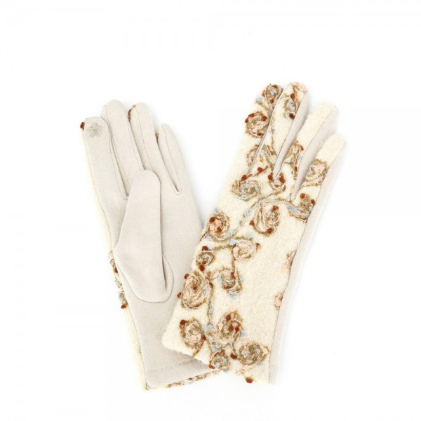 Touchscreen gloves with metallic floral embroidery across a brushed knit back and a soft stretch palm. Conductive fingertips let her text and scroll without taking them off, and the slim fit dresses up a coat sleeve. A fall and winter accessory for boutique gift walls, holiday markets, church, and cold morning commutes. Embroidered texting gloves give a jewelry level gift at an easy price point.