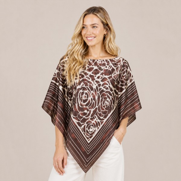 Printed lightweight poncho with a softly draped silhouette and pointed hem. The airy woven fabric layers over a tee, tank, or fitted knit without adding bulk, and the pull-on shape means no sizing headaches on the sales floor. An easy travel and transitional-weather piece for customers who want coverage without committing to a jacket. One size fits most, which makes it a simple, fast-turning add to any clothing rack.