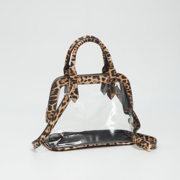 Clear Tote Bag With Vegan Leather Trim

- Full Zip Closure
- Detachable Vegan Leather Cross Body Strap
- Handle Drop 3.5" L
- Approximately 10" L X 7.5" T X 4.5" D