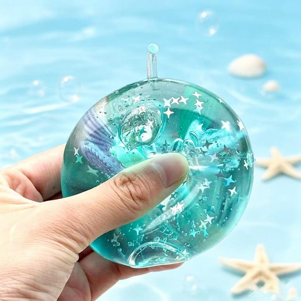 Glitter Nautical Ball Squishy Toy

Cute novelty squishy toy designed as a glitter nautical ball. Perfect for gifts, impulse buys, and themed novelty displays.

- Ages 3+
- Approximately 3" L