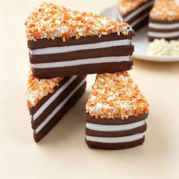 Toasted Coconut Chocolate Cake Squishy Toy

Cute novelty squishy toy designed as piece of toasted coconut chocolate cake. Perfect for gifts, impulse buys, and food themed novelty displays.

- Ages 3+
- Approximately 10" L