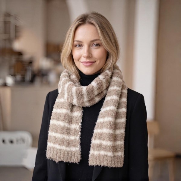Striped fuzzy scarf in a soft eyelash boucle knit, a heavyweight winter scarf built for cold weather retail. Plush brushed yarn, wide contrast stripes, and a long wrap length that layers easily over coats, sweaters, and flannels. A go-to women's fashion scarf for fall and winter boutique displays, tailgates, farmers markets, and holiday gifting. Priced as an easy impulse add on, striped knit scarves reorder fast once temperatures drop.