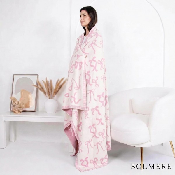 Solmere Blanket – Bow Blanket

Wrap yourself in pure indulgence. Our Solmere Blanket combines a fashion-forward design with an irresistibly soft hand-feel that’s as beautiful as it is cozy.

- Luxuriously Soft – Crafted from ultra-plush, high-quality fibers you’ll want to snuggle into all season long.

- Perfectly Sized – Approximately 50” W x 60” L, perfect for draping over your sofa, bed, or yourself.

- Premium Craftsmanship – 100% polyester for lasting softness, warmth, and easy care.

- Thoughtful Packaging – Each blanket is tied with a branded ribbon in a bow and includes two cards: one featuring the SOLMERE brand and another showcasing a high-quality image of the blanket’s print. Individually packaged

Once you touch it, you’ll understand why SOLMERE blankets are love at first feel.