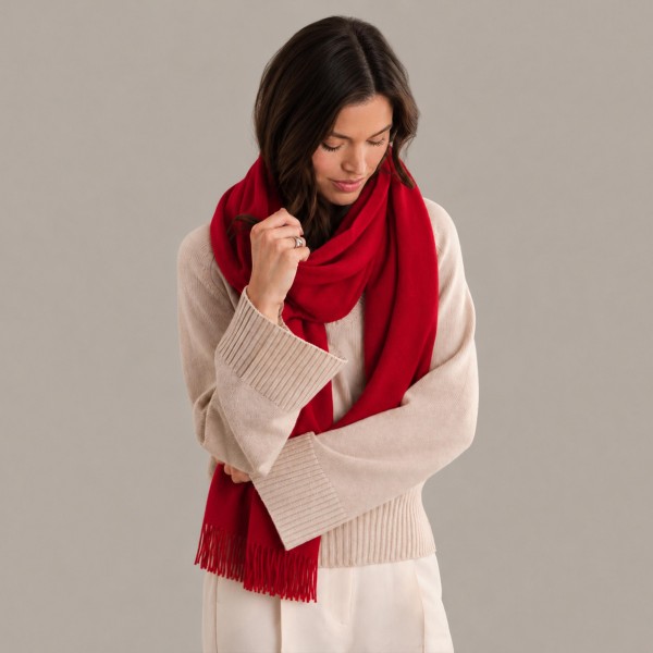 Solid Cashmere Feel Scarf in a soft, brushed blend of 83% polyester and 17% viscose. The oversized 70.9 x 27.6 inch size wraps easily around the neck or drapes over the shoulders like a shawl, finished with 3.9 inch fringe on each end. A warm, cozy layer for chilly days that pairs with coats, sweaters, and everyday outfits. Offered in a wide range of colors, this staple scarf is a must have for fall and winter displays.