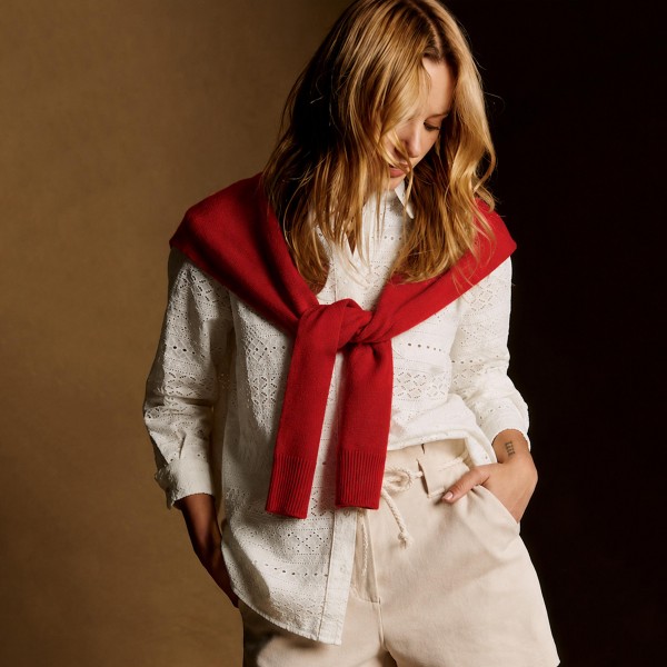 Knitted Shoulder Wrap in a soft blend of 30% cotton and 70% acrylic. Shaped to look like a sweater knotted over the shoulders, it delivers that effortless layered look in seconds. Toss it over a tee, button down, or dress for an instantly polished outfit. One size fits most, and the trend driven style makes it a standout seller for fall and winter.