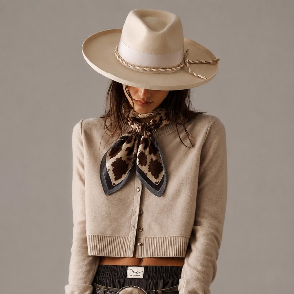 Cow Print Silky Square Scarf with a bold western cowhide pattern framed by a contrast border. Tie it as a neckerchief, knot it on a hat band, wrap a ponytail, or add it to a tote for instant ranch style. Made for rodeos, country concerts, fall festivals, and everyday western looks with denim and boots. Western accessories continue to trend, and cow print scarves are a fun, affordable add on that customers grab fast.