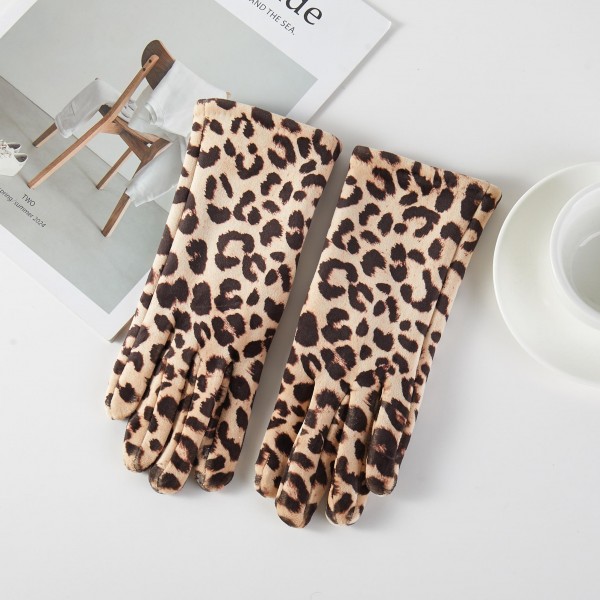 Leopard Print Gloves in a plush, velvety fabric with a bold animal print that instantly elevates any winter outfit. The fitted five finger design keeps hands warm while adding a playful touch to coats and sweaters. Perfect for holiday shopping, girls night out, and everyday cold weather style. Leopard is a year after year best seller, making these gloves an easy add on and a crowd pleasing gift.