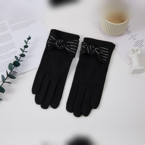 Bow Accent Gloves with a soft brushed finish and a sweet decorative bow at each wrist for a feminine, polished look. The fitted five finger silhouette keeps hands warm and pairs beautifully with wool coats and dressy winter outfits. Lovely for holiday parties, church, date nights, and everyday errands. Pretty bow gloves make a thoughtful gift and are an easy add on sale in any cold weather accessory display.