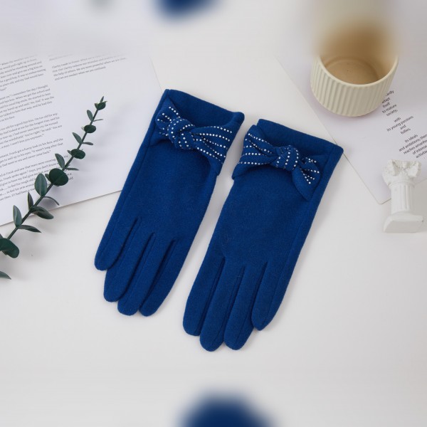 Bow Accent Gloves with a soft brushed finish and a sweet decorative bow at each wrist for a feminine, polished look. The fitted five finger silhouette keeps hands warm and pairs beautifully with wool coats and dressy winter outfits. Lovely for holiday parties, church, date nights, and everyday errands. Pretty bow gloves make a thoughtful gift and are an easy add on sale in any cold weather accessory display.